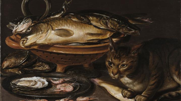 A 17th century still life painting depicting a cat on a table next to a plate of seafood.